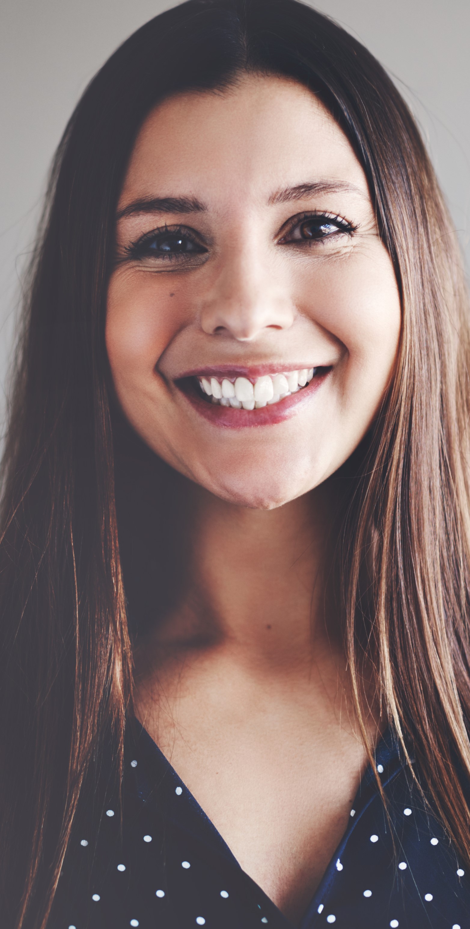 Smiling Woman with Long Hair