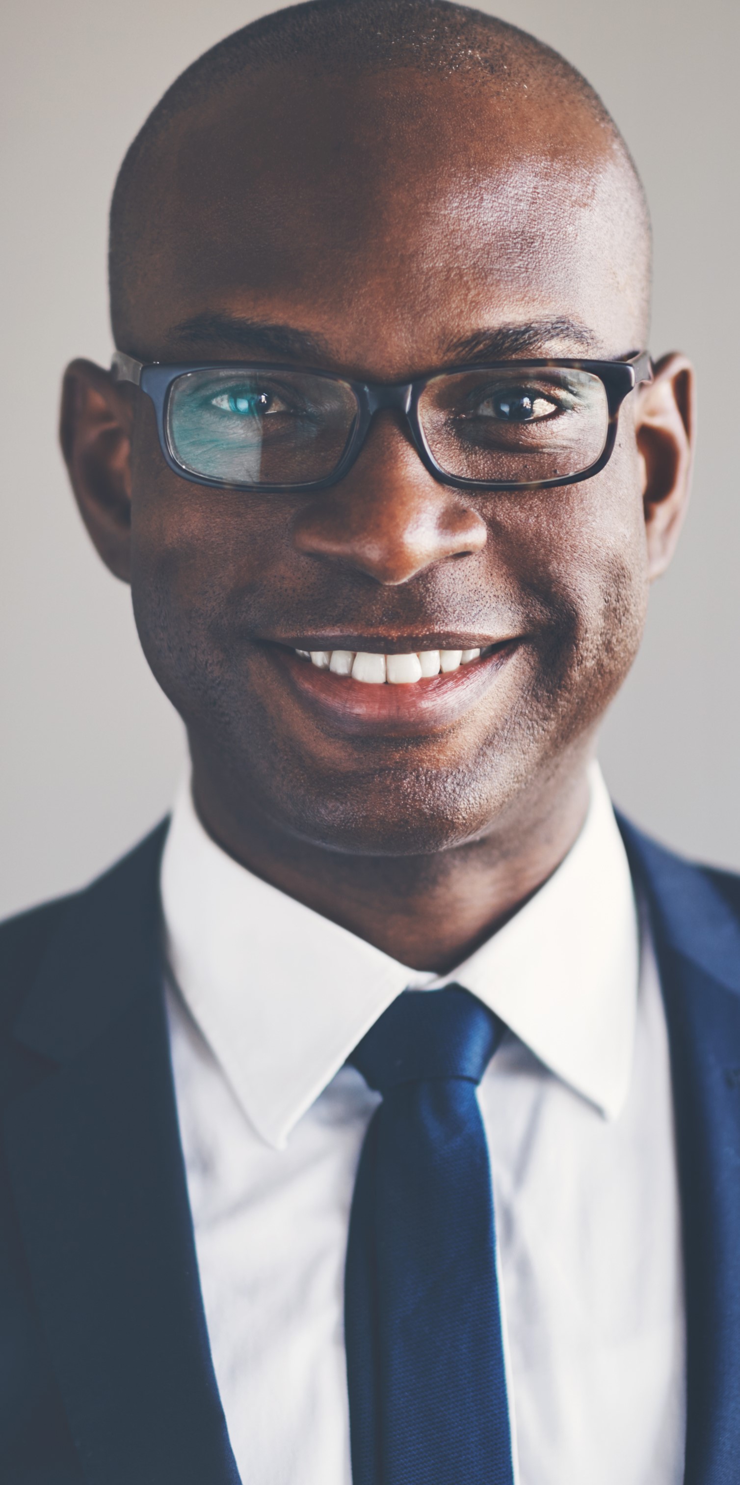 Smiling Man with Glasses